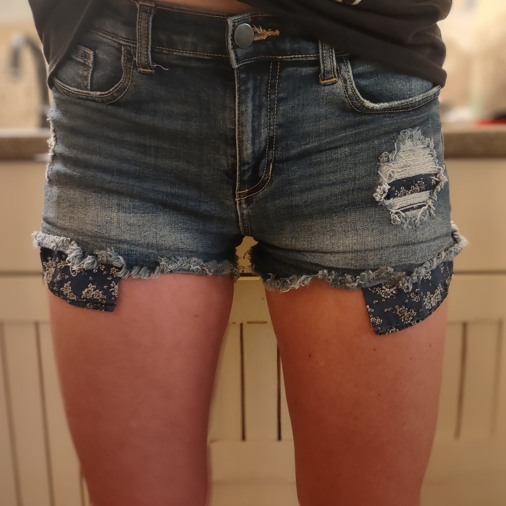 Maurices Blue Distressed Jean Shorts with Floral Accents